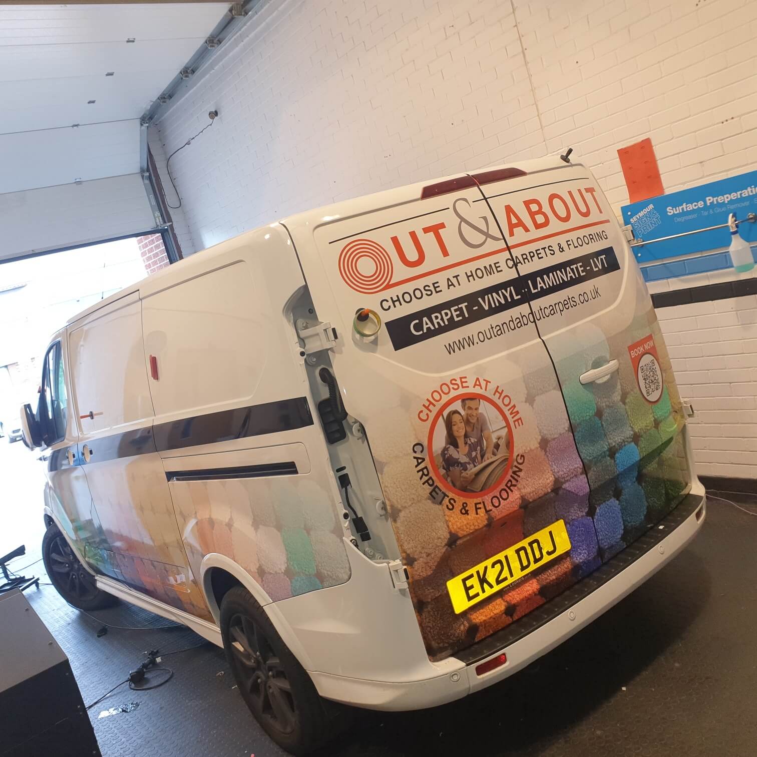 White ford Transit Custom with partial wrap to rear doors