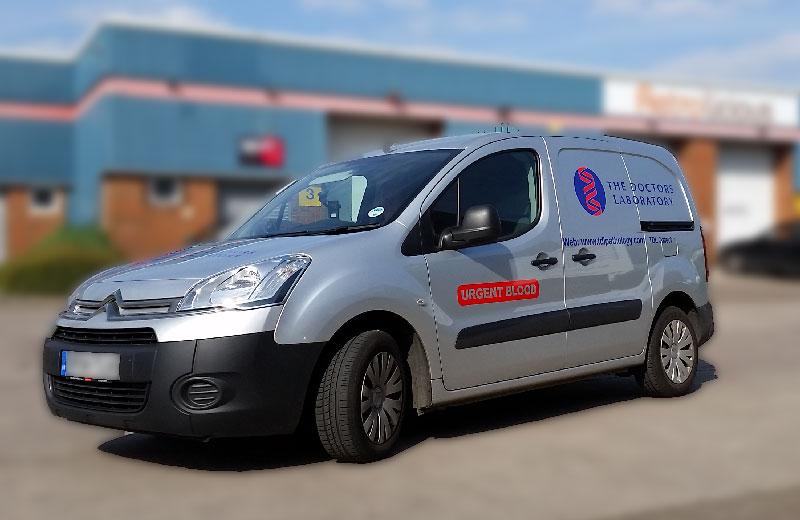 Silver Citroen Berlingo With Signage installed